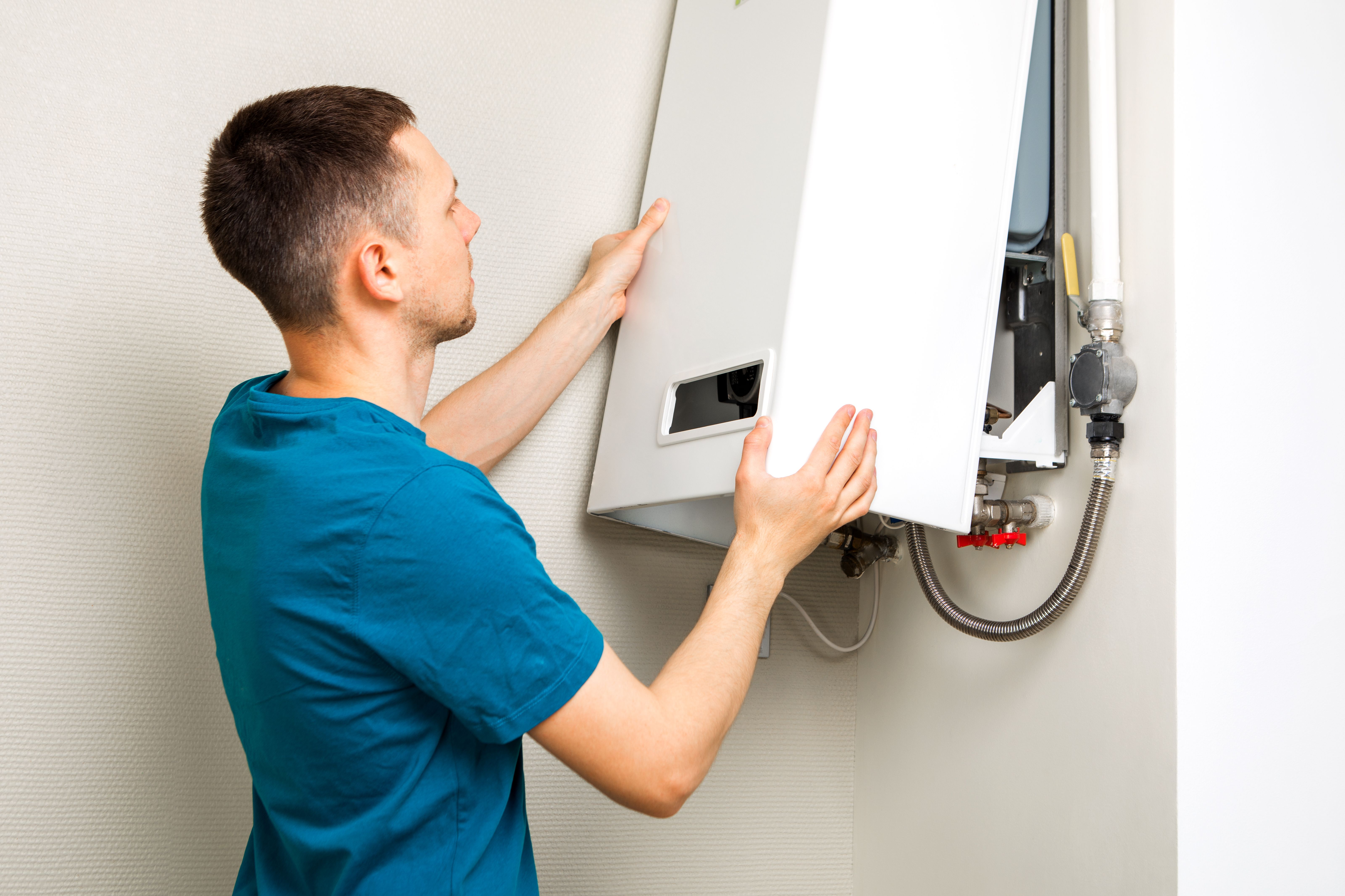 plumber-attaches-trying-fix-problem-with-residential-heating-equipment-repair-gas-boiler (1).jpg